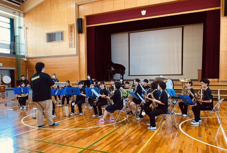 School band practice in gymnasium.